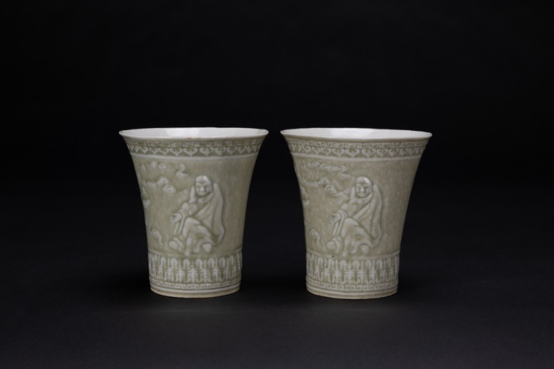 A Pair Of Gray Green Glazed Molded&rsquo;Arhat And Shou&rsquo; Cups,
