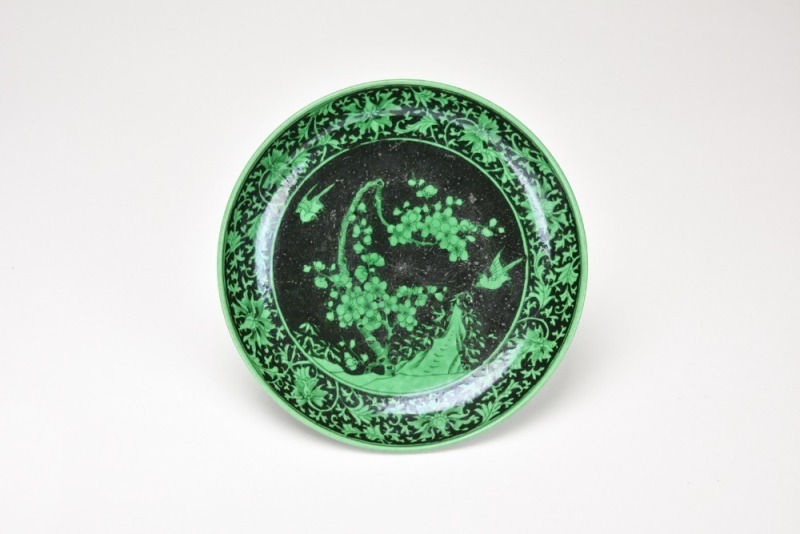 A Black Ground Green Glazed &lsquo;Magpies And Plum Blossom&rsquo; Dish.
