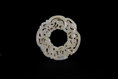 A Finely Carved Openwork Jade Bi Disc with Chilong and Phoenix. Han Dynasty