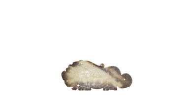 Spring and Autumn Period. A Finely Carved Russet and Celadon Jade Tigar