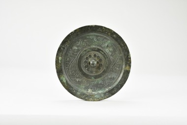A Bronze Mirror with Auspicious Beasts. Han Dynasty (206 BC &ndash; AD 220).