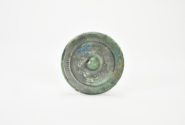 A Bronze Mirror with High-Relief Dragon and Tiger MotifsChina, Han Dynasty (206 BCE &ndash; 220 CE).