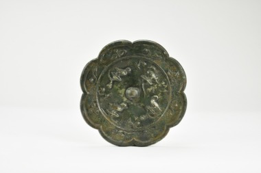 A Chinese Bronze Octafoil Mirror with Birds and Foliage, Tang Dynasty (618&ndash;907).