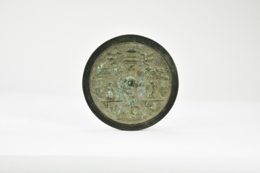 A Chinese Bronze Circular Mirror with Cranes and Pavilion Motif, Yuan Dynasty.