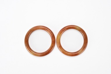 A Pair of Reddish Jadeite Bangles