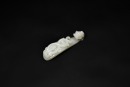 A Finely Carved White Jade Belt Hook with Incised Geometric Decoration, Qianlong Period, (Mid-18th Century)