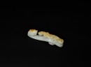 A Finely Carved White Jade Belt Hook with Russet Inclusions and Chilong Design, Qianlong Period (1736&ndash;1795)