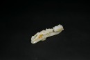 A Fine White Jade Belt Hook with Russet Inclusions and Chilong Design, the Button Carved with Floral Motif, Qing Dynasty, 18th&ndash;19th Century