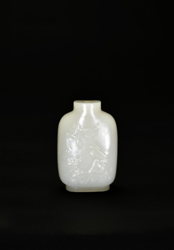 A Yellow-Russet and White Jade Snuff Bottle Carved with &lsquo;Double Magpies and Plum Blossoms&rsquo; &ndash; Joy Up to the Eyebrows, Qing Dynasty (18th&ndash;19th Century)