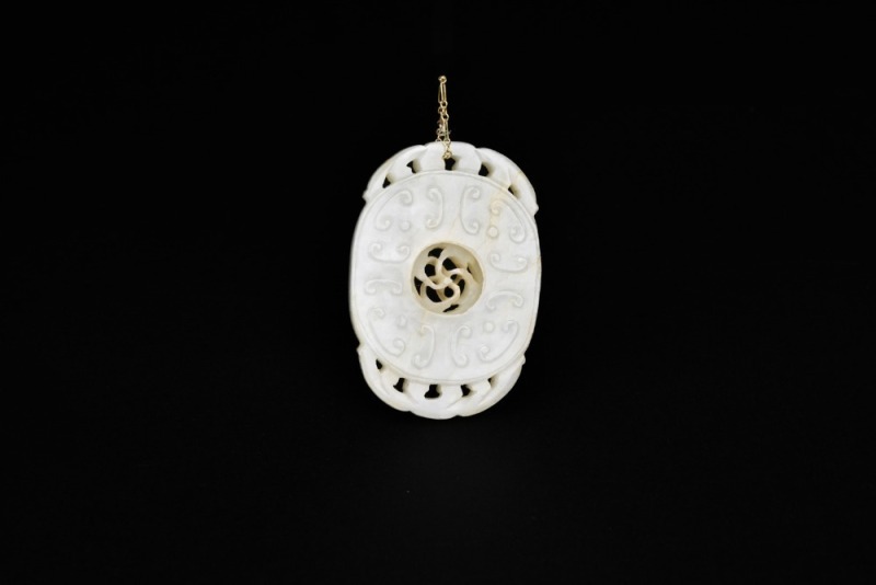 A White Jade &lsquo;Spinning Center&rsquo; Openwork Pendant, Qing Dynasty (18th&ndash;19th Century)