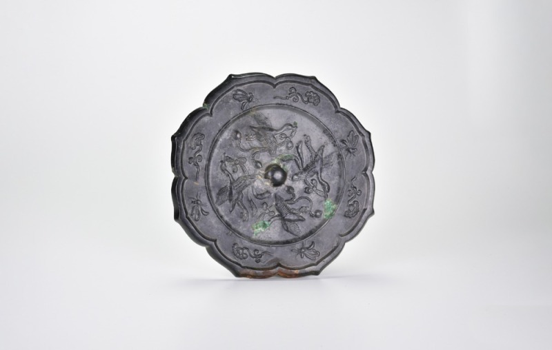 A Bronze &lsquo;Four Flying Cranes around Floral Scroll&rsquo; Mirror, Tang Dynasty