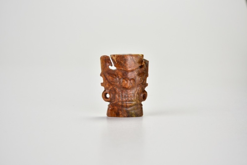A Brown Jade Ornament Carved with a Divine Mask, Shijiahe Culture, ca. 2500&ndash;2000 BC.