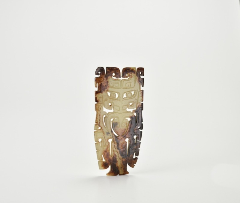 A Rare Celadon Jade Openwork Plaque Carved with a Mask Motif, Shang Dynasty (circa 13th&ndash;11th Century BC)