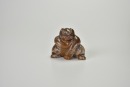 A Brown Jade Figure of a Bear, Han Dynasty (circa 2nd Century BC &ndash; 1st Century AD)