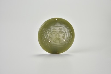 A Rare Archaic Celadon Jade Circular Plaque Carved with a Shamanic Mask, Shijiahe Culture, ca. 2500&ndash;2000 BC.