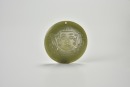 A Rare Archaic Celadon Jade Circular Plaque Carved with a Shamanic Mask, Shijiahe Culture, ca. 2500&ndash;2000 BC.