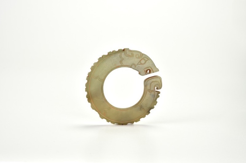 A Rare Celadon Jade Dragon-Head RingWestern Zhou Dynasty (circa 1046-771 Century BC)