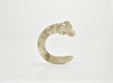 A Rare Archaic Celadon Jade Hook-Shaped Ornament with Animal Head, Shang Dynasty (circa 13th&ndash;11th Century BC)