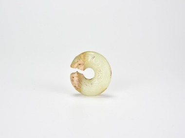 A Rare Archaic Yellow Jade &lsquo;Coiled-Tail Tiger&rsquo;, Shang Dynasty (c. 13th&ndash;11th century BCE)