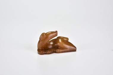A Fine Russet-Stained Jade Figure of a Hound, Song Dynasty (10th&ndash;13th century CE)