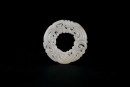 A Reticulated Celadon Jade &lsquo;Dragon&rsquo; Disc. Han Dynasty (206 BC&ndash;AD 220).