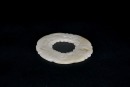 A Reticulated Celadon Jade &lsquo;Dragon&rsquo; Disc. Han Dynasty (206 BC&ndash;AD 220). - 2
