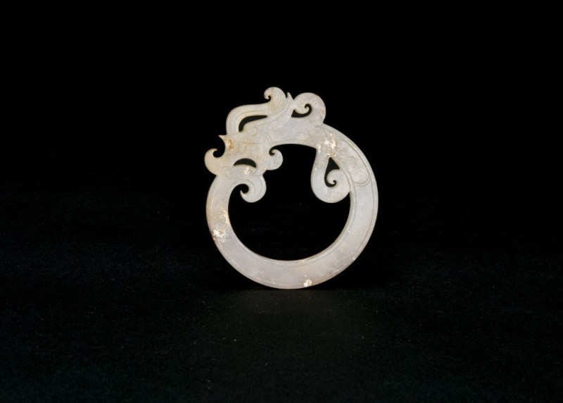 A Celadon Jade &lsquo;Coiled-Tail Dragon&rsquo; Pendant. Han Dynasty (206 BC&ndash;AD 220).