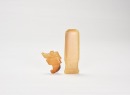 A Group of Two Jade Ornaments: A Human-Deity Pendant and a Handle-Shaped Implement. Shang Dynasty, ca. 16th&ndash;11th century BC. (1) Human-Deity Pendant. Carved from yellowish-brown jade. (2) Handle-Shaped Jade Implement.