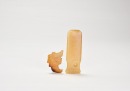 A Group of Two Jade Ornaments: A Human-Deity Pendant and a Handle-Shaped Implement. Shang Dynasty, ca. 16th&ndash;11th century BC. (1) Human-Deity Pendant. Carved from yellowish-brown jade. (2) Handle-Shaped Jade Implement. - 2