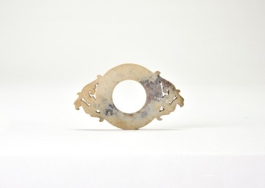 A Han Dynasty Jade Pendant Carved with Confronted Phoenix Motifs.