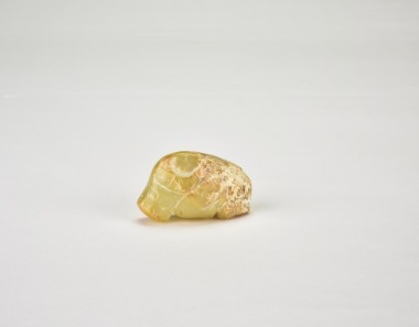 A Jade Recumbent Ox Pendant. Han Dynasty.