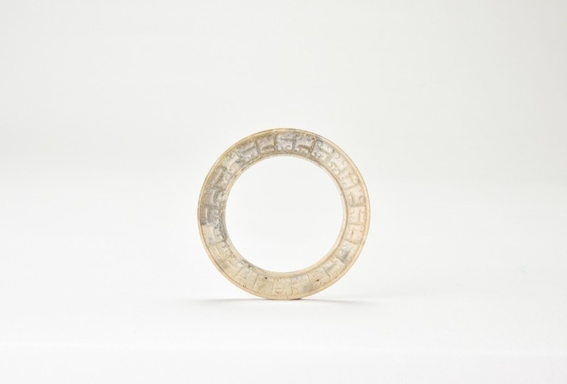 A Jade Ring Carved with Scroll and Chilong Motifs. Warring States period (475&ndash;221 BC).