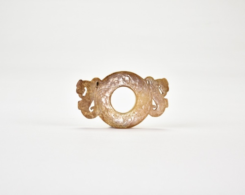 Western Han Dynasty (circa 2nd&ndash;1st century BC) A Carved Jade Ring Pendant with Twin Mythical Beast Heads