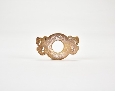 Western Han Dynasty (circa 2nd&ndash;1st century BC) A Carved Jade Ring Pendant with Twin Mythical Beast Heads