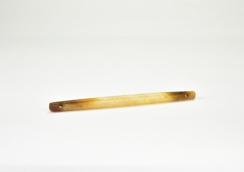 Han Dynasty (Western Han to early Eastern Han, circa 2nd century BC &ndash; 1st century AD), A Jade Tubular Pendant Carved with Cloud Motifs