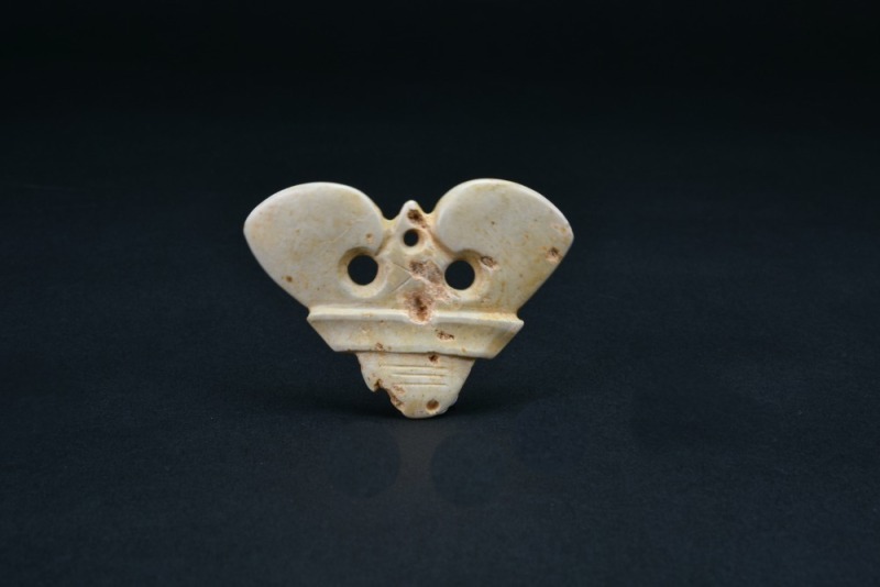 Late Neolithic Period. A Jade (or Stone) Anthropomorphic Mask Pendant.