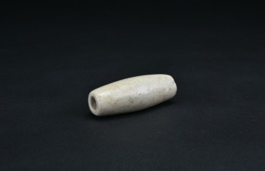 A Jade Tubular Ornament (Jade Tube) China, possibly Neolithic to Early Bronze Age.