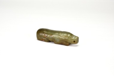 A Celadon Jade Pig-Form Pendant.