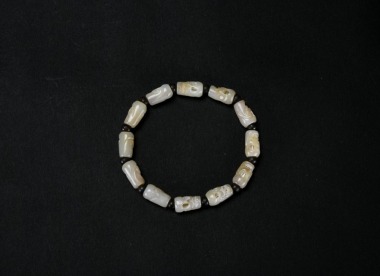A Chinese Jade Bead Bracelet. China, Late Qing / Republic Period.