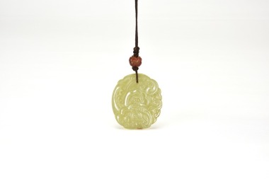 Late Qing to Early Republic Period. A Celadon Jade &lsquo;Ruyi&rsquo; Cloud Pendant.