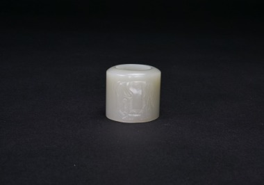 A White Jade Carved Elephant Archer Ring.