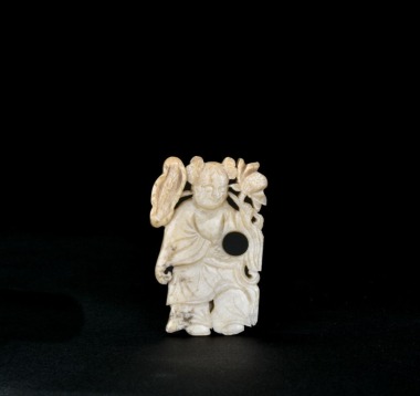 Ming&ndash;Qing Dynasty. A Finely Carved White Jade Openwork Pendant Depicting a Boy With Lotus.