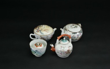 Four Famille-Rose Wares, Comprising Three Figural Teapots and One Landscape Cup. Qing Dynasty.