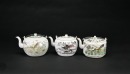 A Group of Three Famille-Rose Teapots with Landscape and Bird-and-Flower Designs, Tongzhi Marks