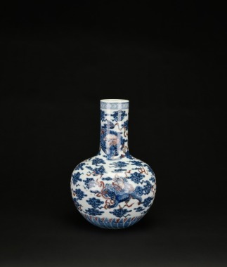 A Blue and Iron-Red &lsquo;Mythical Beast&rsquo; Decorated Long-Neck Vase, Qing Dynasty