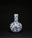 A Blue and Iron-Red &lsquo;Mythical Beast&rsquo; Decorated Long-Neck Vase, Qing Dynasty