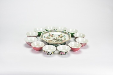 A Group of Twelve Famille-Rose Teacups with One Dish on Pale Green Ground
