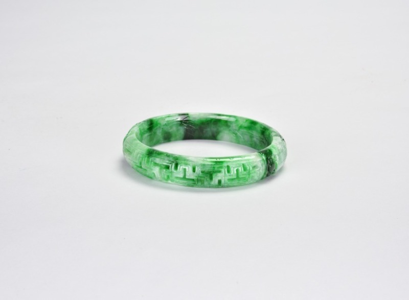 A Carved Jadeite &lsquo;Key-Fret&rsquo; Bangle
