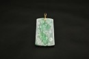 One Carved Jadeite Pendant With &lsquo;Fu Shou&rsquo; Motif And 14K Gold Mount