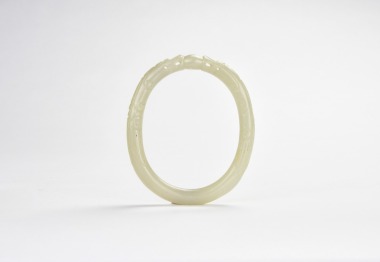 A Celadon Jade &lsquo;Double Dragon Chasing Pearl&rsquo; Bangle &lsquo;Qing Dynasty&rsquo;